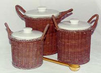 A set of ceramic jars with enclosed in a rattan basket