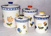 Set of ceramic cookie jars with hand painted designs